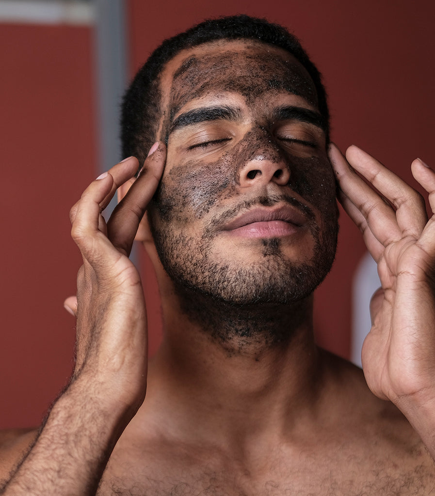 photo of model applying natural charcoal sugar scrub form curativo apothecary by badami and co