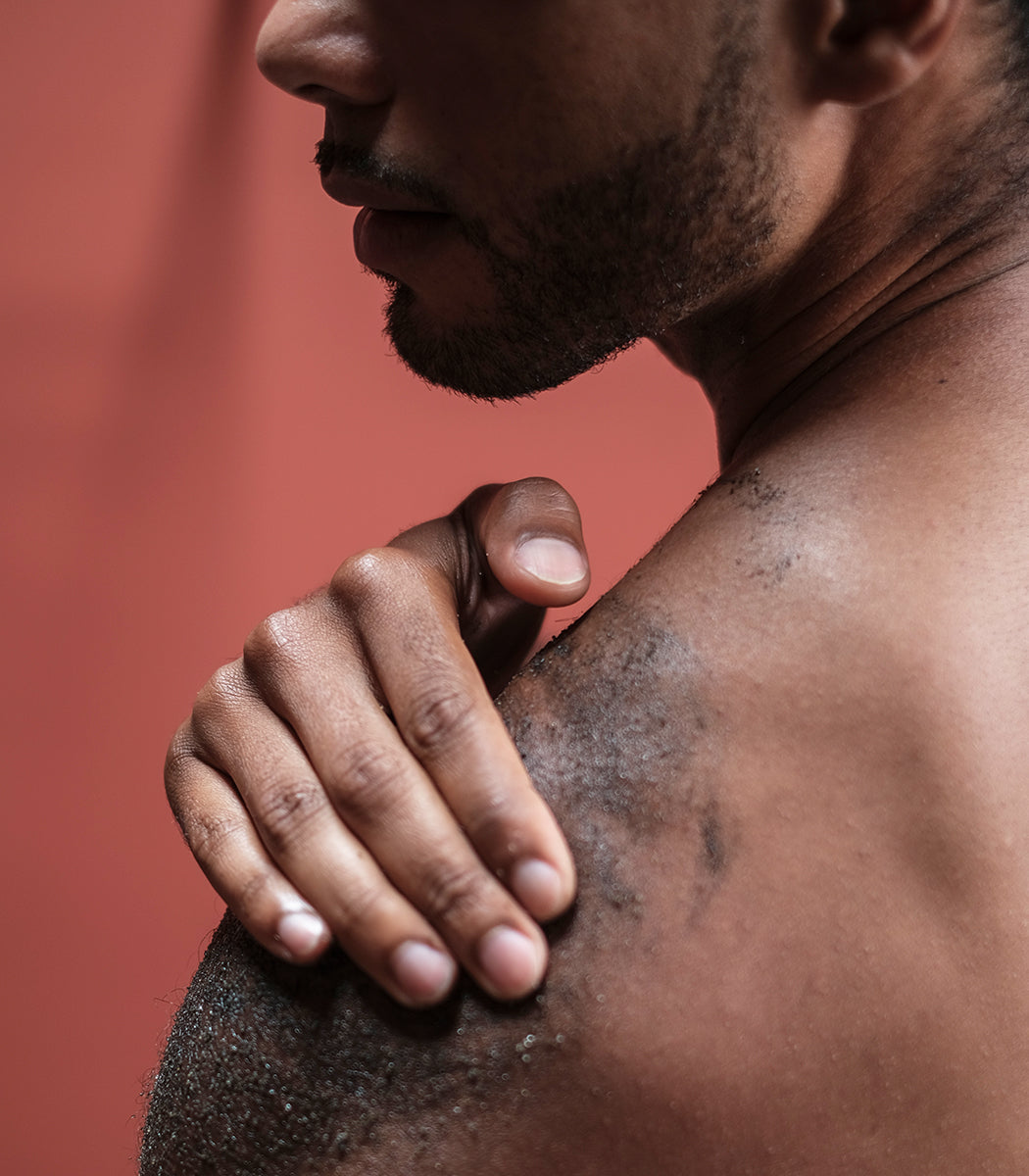 photo of model applying natural charcoal sugar scrub form curativo apothecary by badami and co